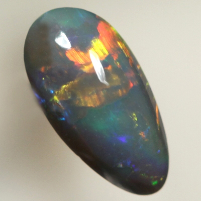 SOLID BLACK OPAL Bright rolling flashes over a medium high dome